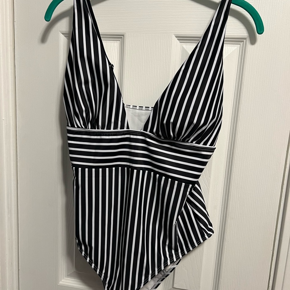 Women’s size large one piece. New without tags.